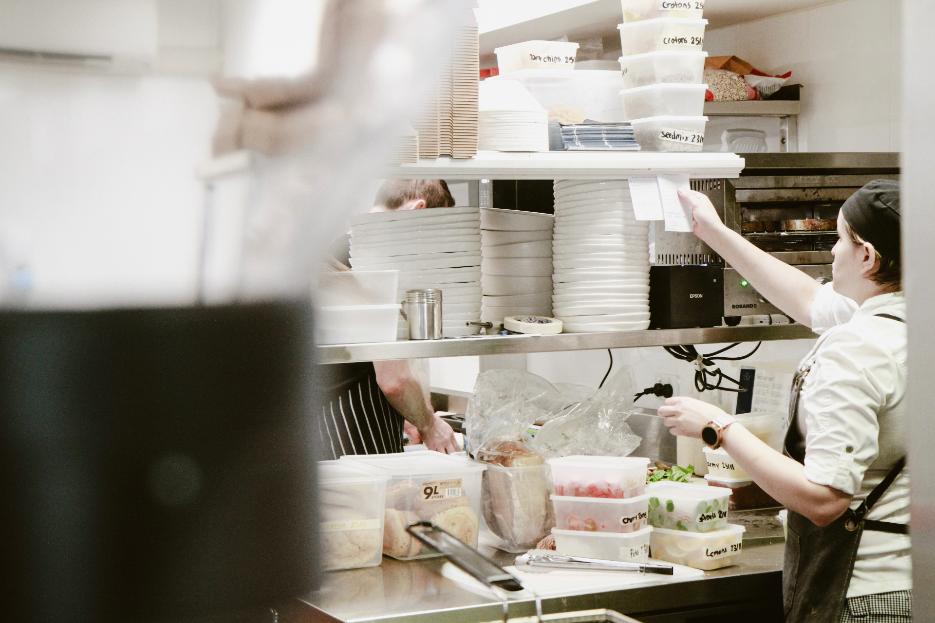 Kitchen team working the pass during service