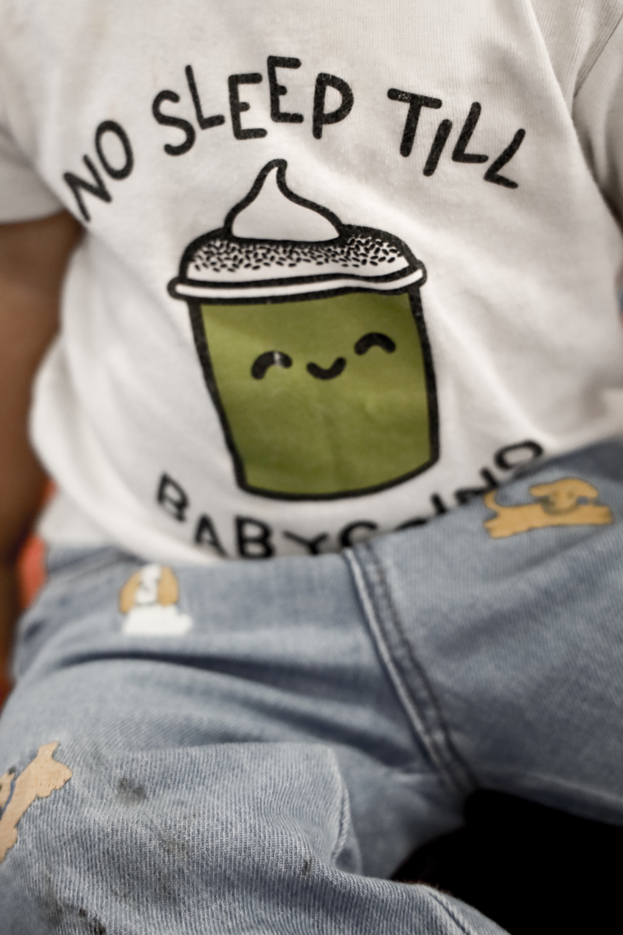 Toddler wearing a 'No sleep till Babychino' tee