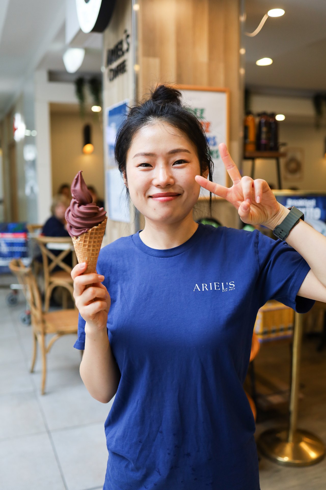 Customer holding ice cream at Ariel's