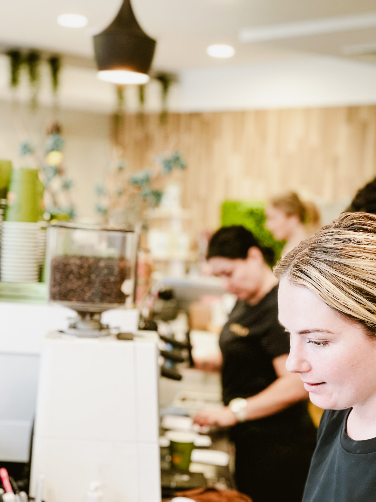 Ariel's Coffee team working together on the café floor