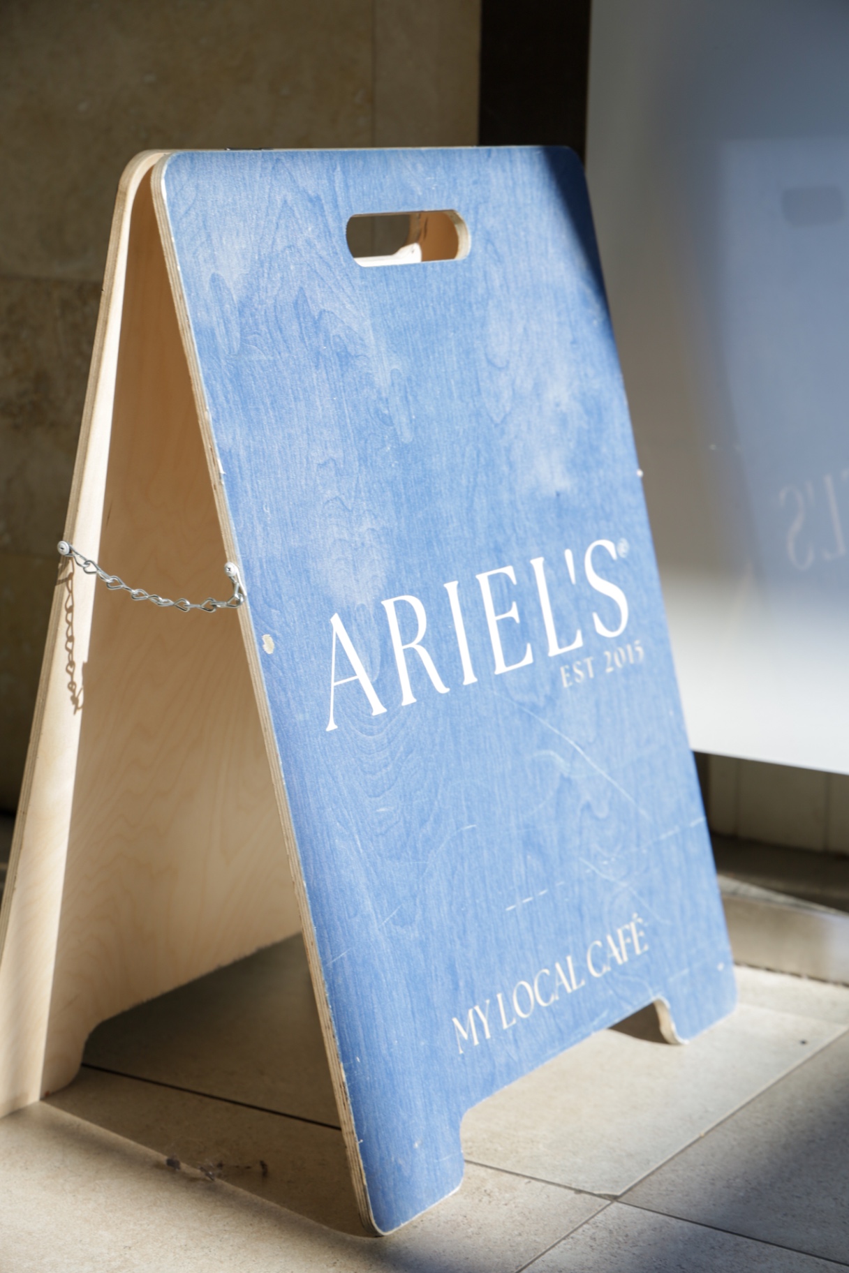 Blue Ariel's My Local Café A-frame sign on timber