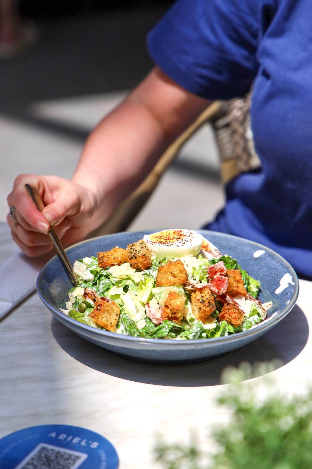 Caesar salad with crispy croutons and soft egg