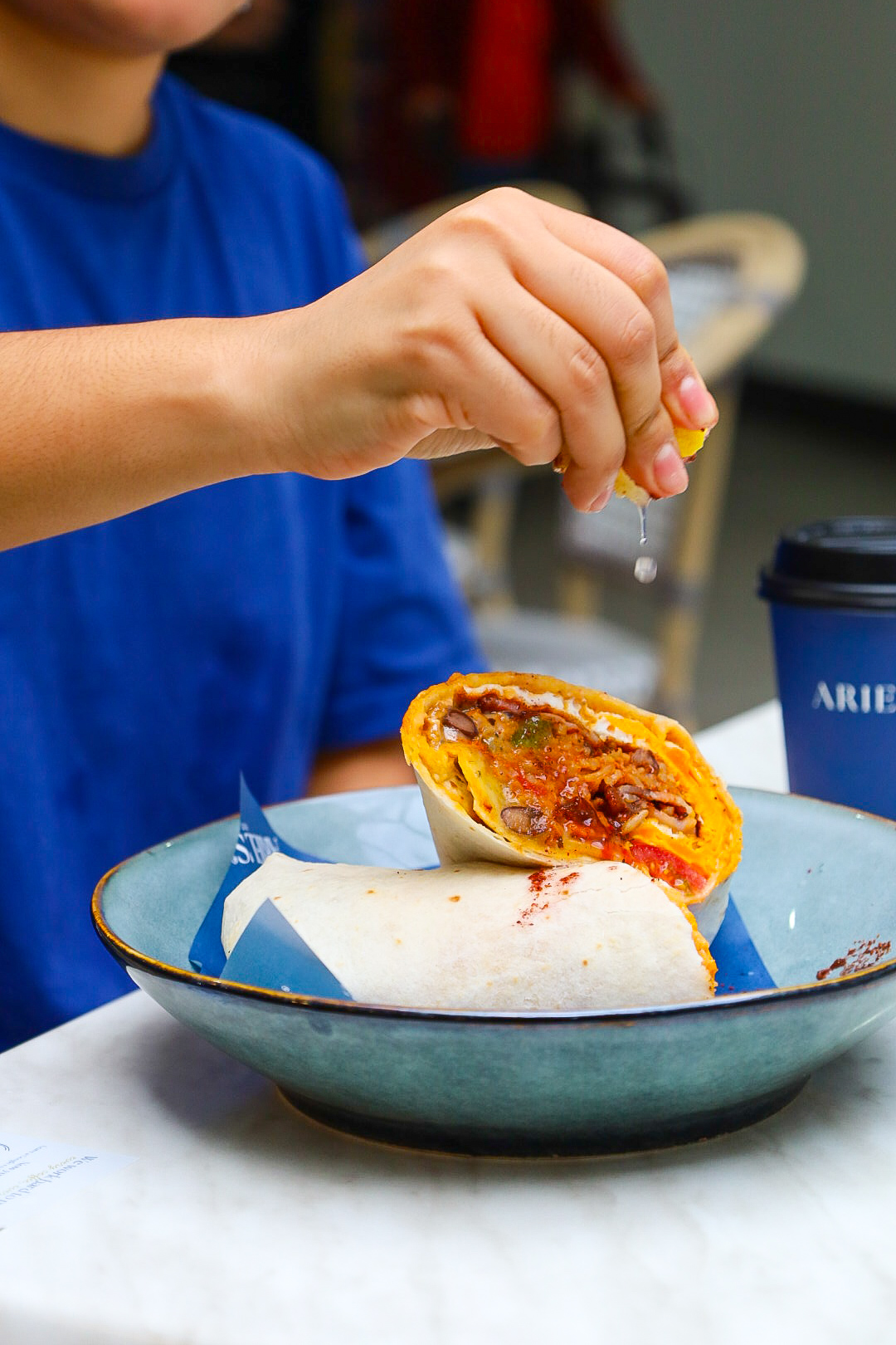 Fresh breakfast burrito with Ariel's coffee