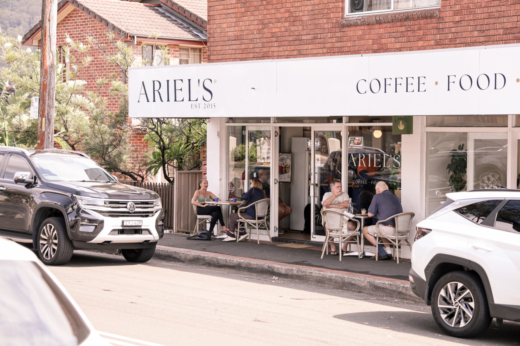 Ariel's Balgownie storefront with locals dining out front